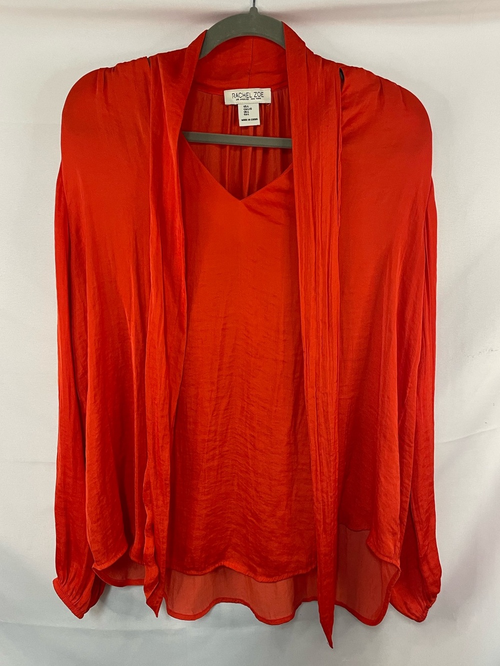 Rachel Zoe vibrant orange saltine blouse with a gorgeous neck tie closure.